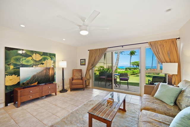 tiled living room with a ceiling fan and recessed lighting