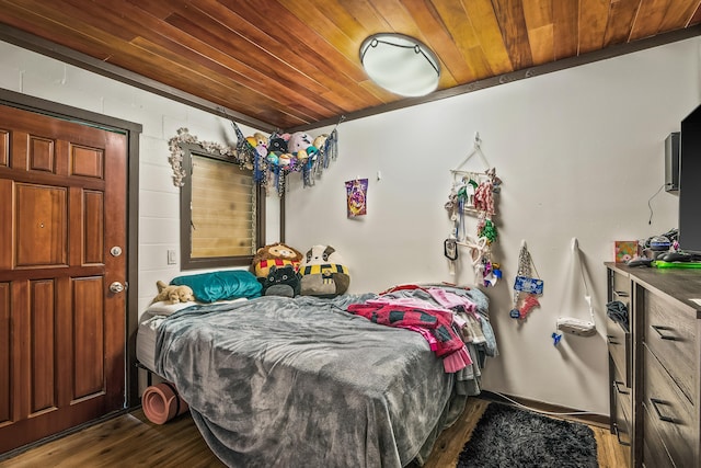 bedroom featuring wood ceiling and dark wood finished floors