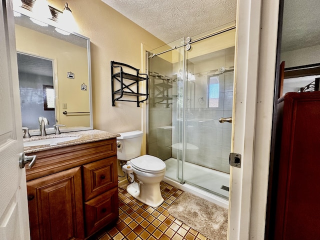 73-1228 Kaiminani Dr, Kailua-Kona, HI 96740 - full bathroom featuring a textured ceiling, toilet, a shower stall, vanity, and tile patterned floors