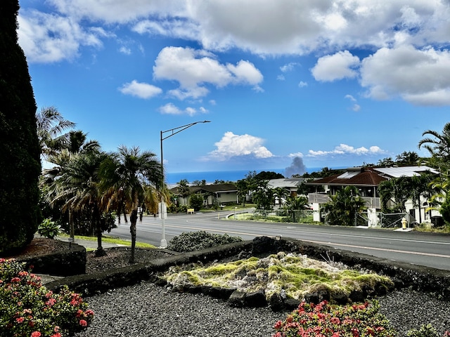 73-1228 Kaiminani Dr, Kailua-Kona, HI 96740 - view of asphalt street with street lights and a residential view