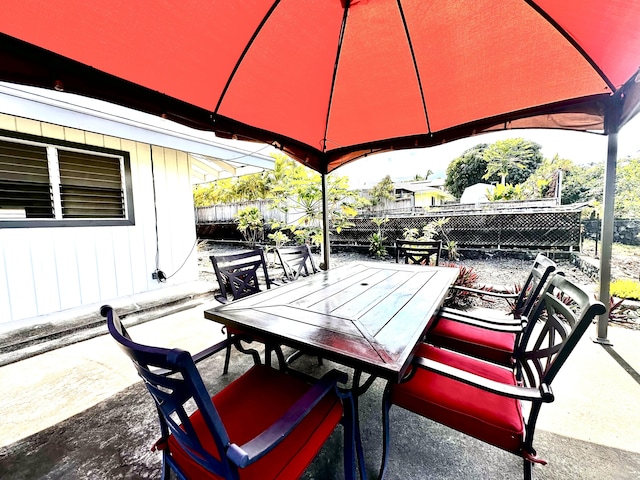 73-1228 Kaiminani Dr, Kailua-Kona, HI 96740 - view of patio / terrace featuring outdoor dining space, fence, and a gazebo