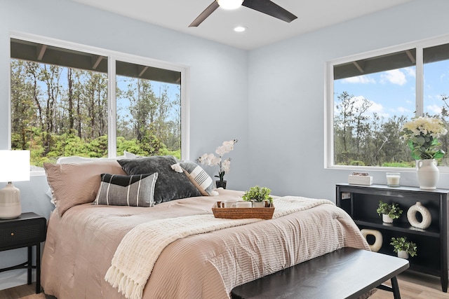bedroom featuring wood finished floors, recessed lighting, and a ceiling fan
