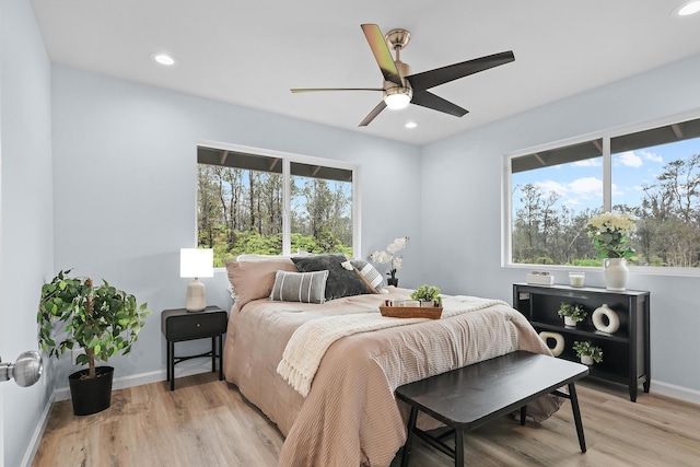 bedroom featuring light wood-style flooring, recessed lighting, baseboards, and a ceiling fan