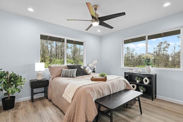 bedroom with light wood-style floors, recessed lighting, baseboards, and ceiling fan