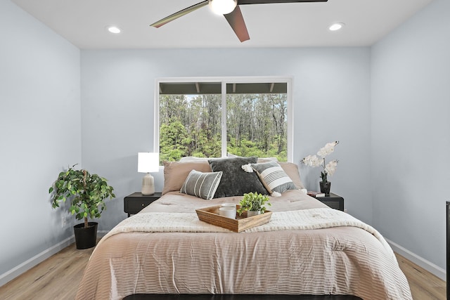 bedroom with baseboards, light wood-style flooring, recessed lighting, and a ceiling fan