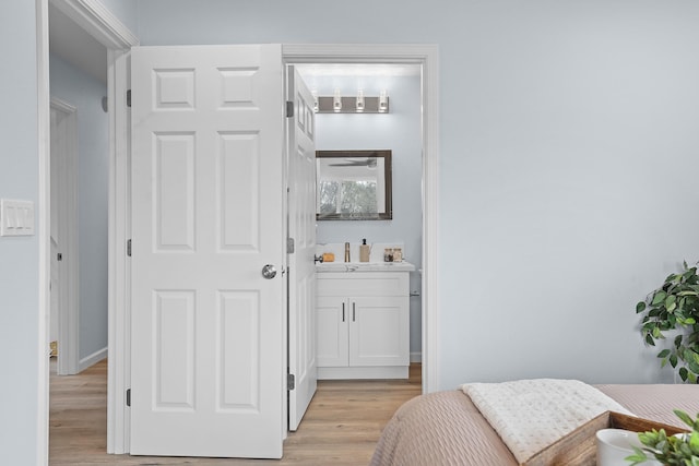 bedroom with light wood-type flooring