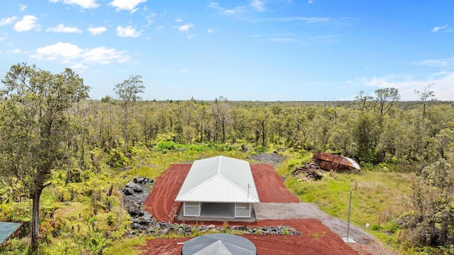 view from above of property featuring a forest