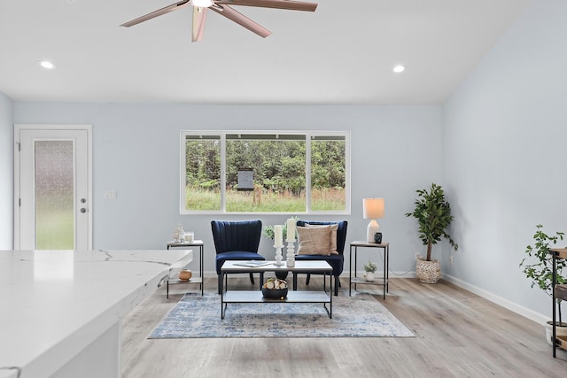 sitting room with a ceiling fan, baseboards, wood finished floors, and recessed lighting