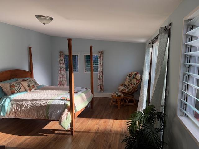bedroom featuring wood finished floors