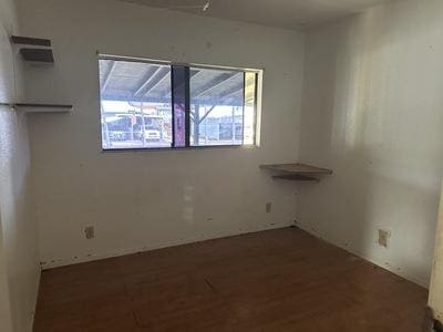 empty room featuring wood finished floors