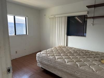 bedroom featuring wood finished floors