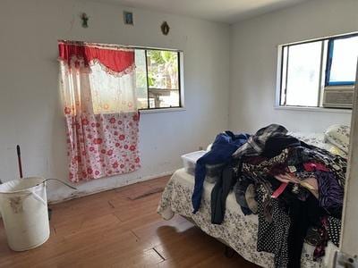 bedroom featuring wood finished floors