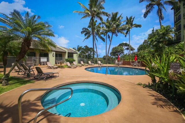 3-3400 Kuhio Hwy Unit B406, Lihue, HI 96766 - community pool featuring fence, a patio, and a community hot tub