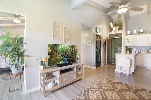3-3400 Kuhio Hwy Unit B406, Lihue, HI 96766 - entrance foyer featuring a ceiling fan, beamed ceiling, light wood-style floors, baseboards, and a towering ceiling