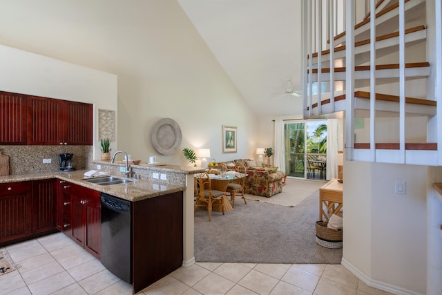 69-200 Pohakulana Pl Unit J33, Waikoloa, HI 96738 - kitchen with a sink, black dishwasher, reddish brown cabinets, light carpet, and a peninsula