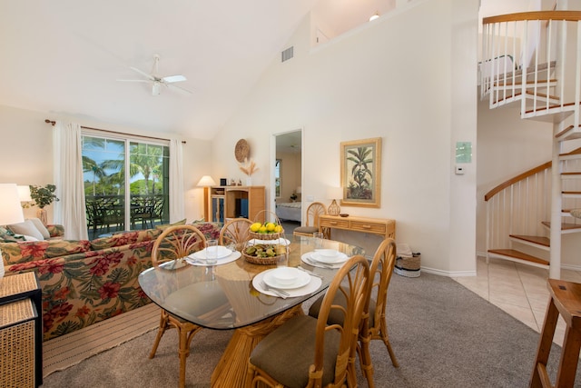 69-200 Pohakulana Pl Unit J33, Waikoloa, HI 96738 - carpeted dining area with stairs, high vaulted ceiling, a ceiling fan, and tile patterned floors