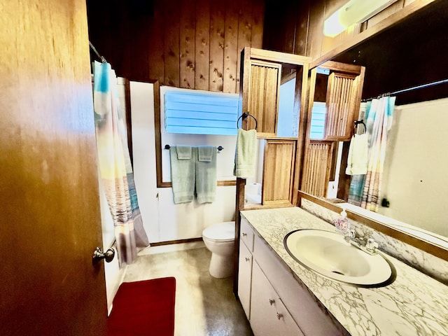 full bath featuring vanity and toilet