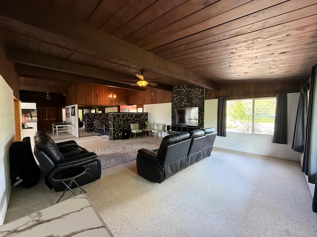 carpeted living room featuring wood ceiling, wooden walls, a ceiling fan, and beam ceiling