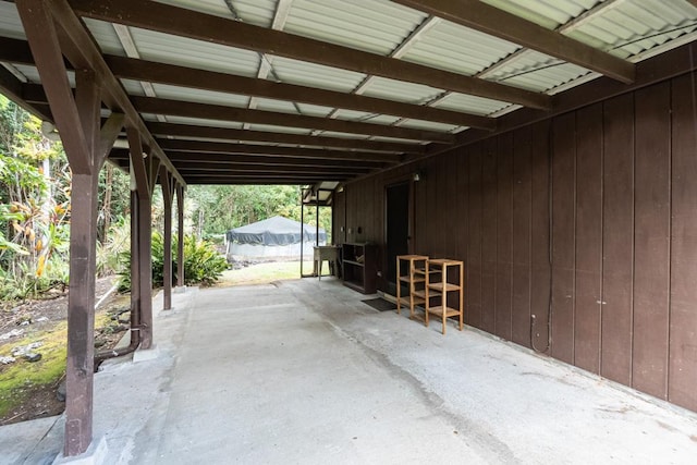 exterior space with a carport