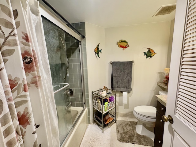 full bath featuring shower / bath combination with glass door, toilet, baseboards, tile patterned floors, and vanity