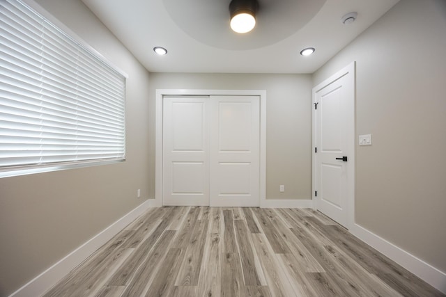 16-2074 Sandalwood Dr, Pahoa, HI 96778 - unfurnished bedroom with light wood-style floors, a closet, baseboards, and ceiling fan
