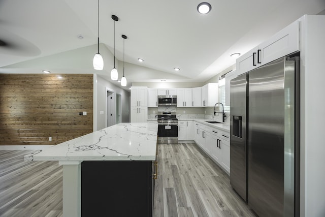 16-2074 Sandalwood Dr, Pahoa, HI 96778 - kitchen featuring appliances with stainless steel finishes, a sink, lofted ceiling, a center island, and light wood-style floors