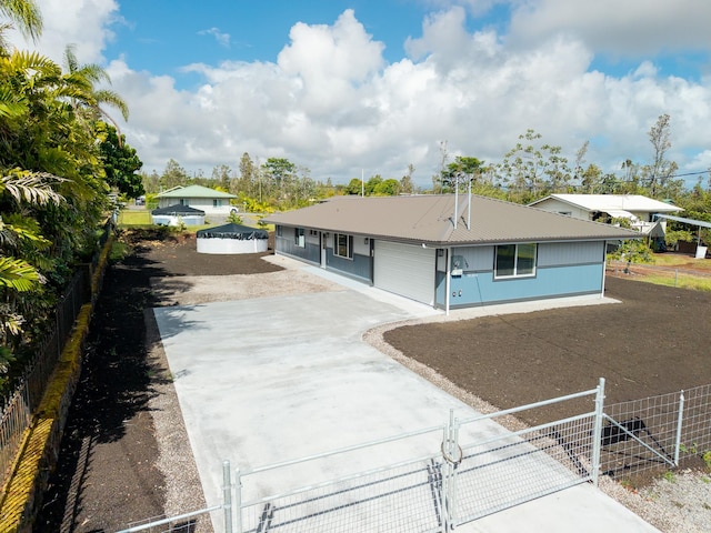 16-2074 Sandalwood Dr, Pahoa, HI 96778 - ranch-style house featuring driveway and metal roof