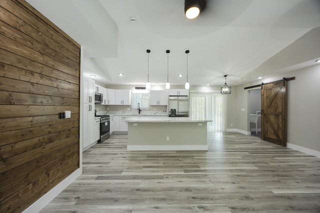16-2074 Sandalwood Dr, Pahoa, HI 96778 - kitchen featuring stainless steel appliances, a barn door, a sink, white cabinetry, and recessed lighting