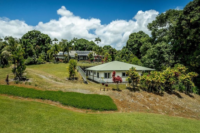 27-414 Old Mamalahoa Hwy, Papaikou, HI 96781 - view of front of house with a front lawn
