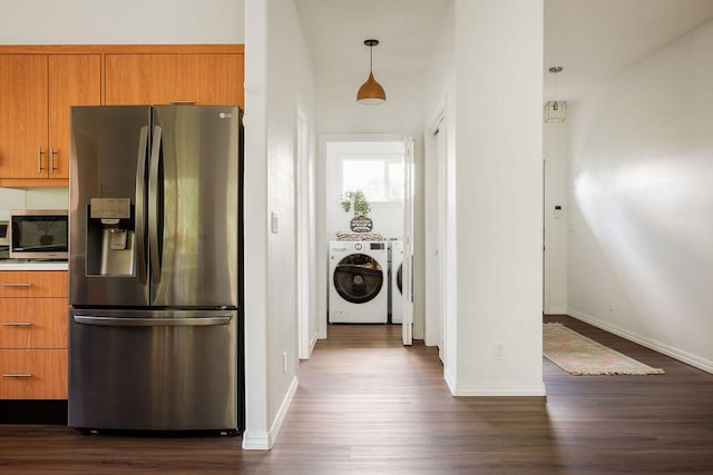 27-414 Old Mamalahoa Hwy, Papaikou, HI 96781 - kitchen featuring appliances with stainless steel finishes, washing machine and dryer, dark wood-style flooring, and brown cabinets
