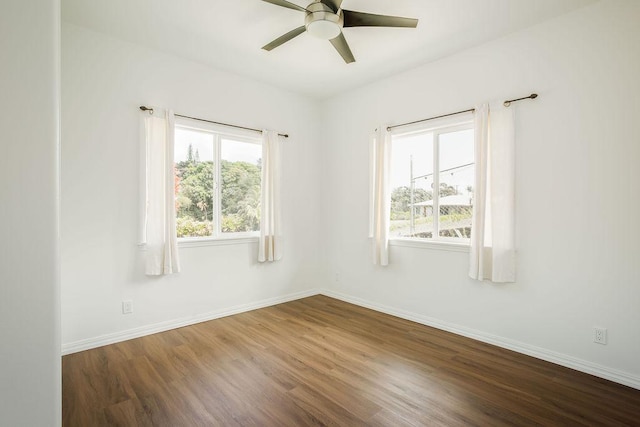 27-414 Old Mamalahoa Hwy, Papaikou, HI 96781 - unfurnished room featuring dark wood finished floors, ceiling fan, and baseboards