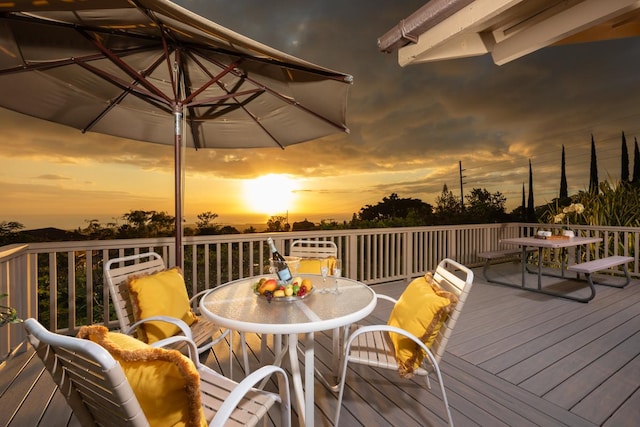 wooden terrace with outdoor dining space