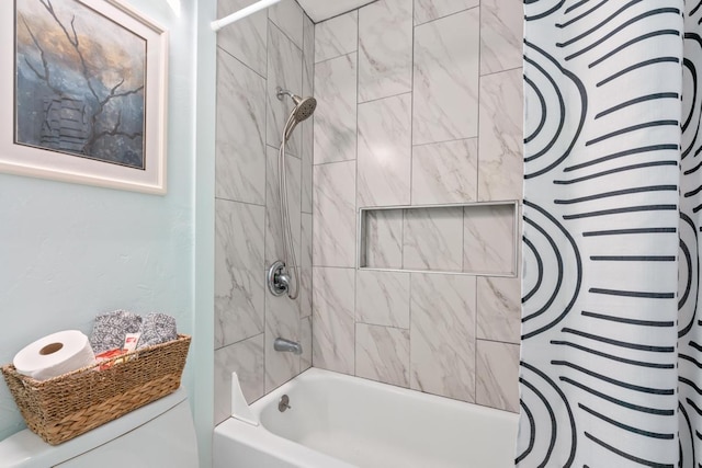 full bathroom with shower / bath combo with shower curtain and toilet