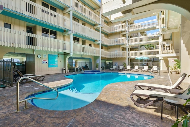 community pool featuring a patio area