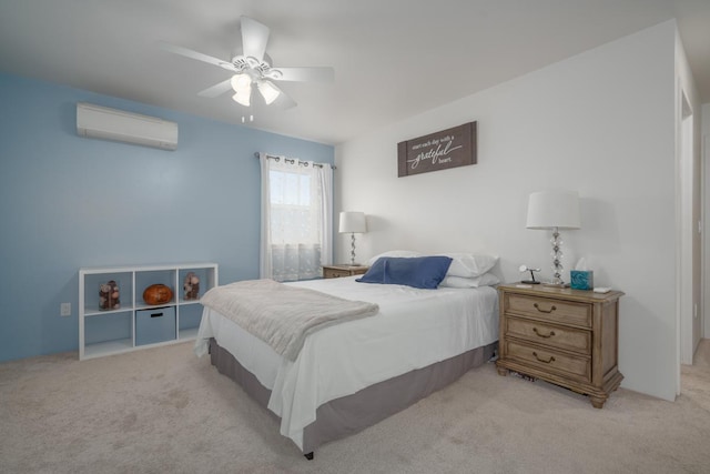 carpeted bedroom featuring ceiling fan and a wall mounted AC