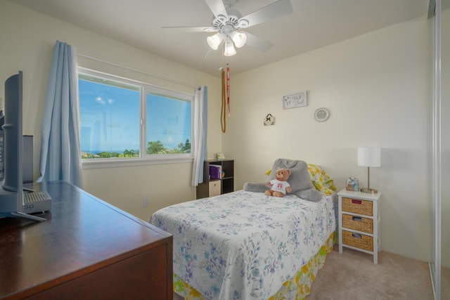 carpeted bedroom featuring ceiling fan