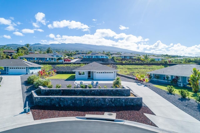 aerial view featuring a mountain view and a residential view