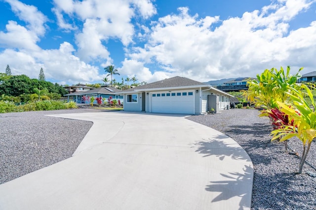 ranch-style home with an attached garage and driveway