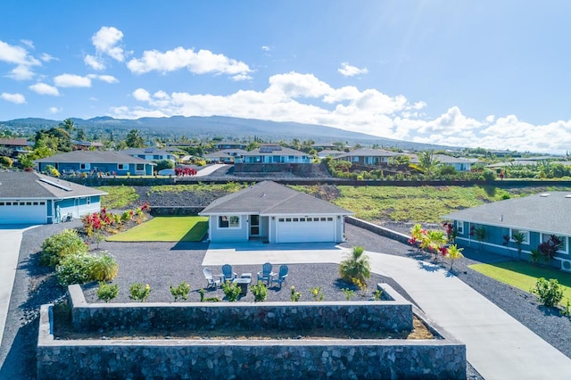 drone / aerial view with a mountain view and a residential view