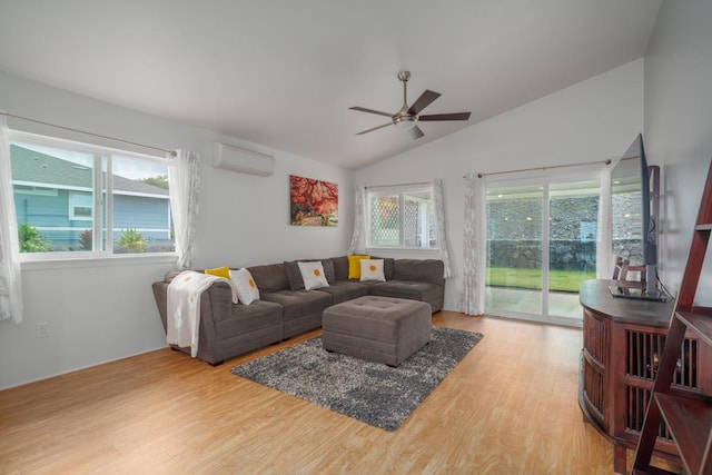 living room featuring ceiling fan, lofted ceiling, a wall mounted AC, and plenty of natural light