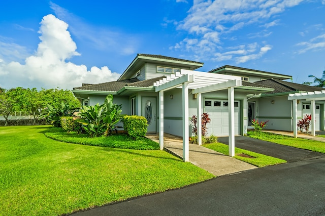 view of front of home featuring a garage, a pergola, driveway, and a front yard