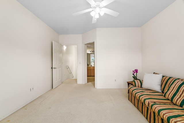 living room featuring light carpet and a ceiling fan
