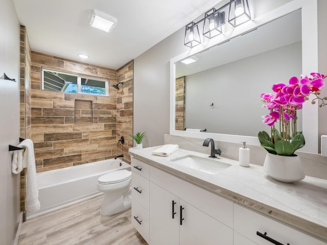 full bathroom featuring shower / bathtub combination, vanity, toilet, and wood finished floors