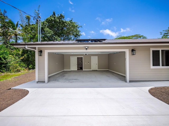 garage with concrete driveway
