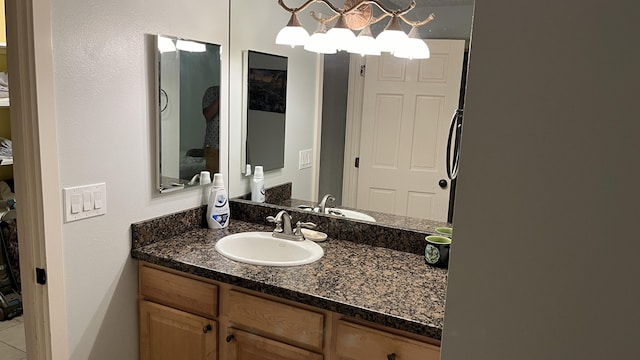 bathroom featuring vanity and tile patterned flooring