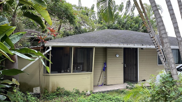 view of front of property with a shingled roof