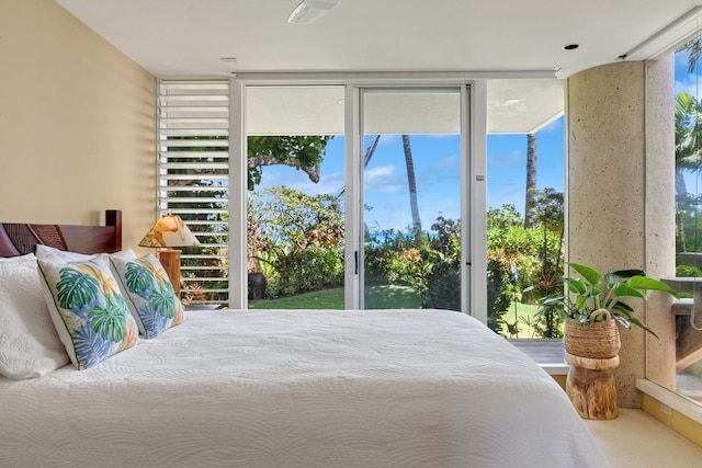 3704 Anini Rd, Kilauea, HI 96754 - carpeted bedroom featuring expansive windows, access to exterior, and multiple windows