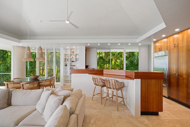 3704 Anini Rd, Kilauea, HI 96754 - kitchen featuring open floor plan, stainless steel built in fridge, a kitchen breakfast bar, and modern cabinets