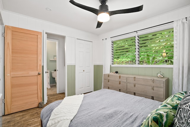 bedroom with wood finished floors and a ceiling fan