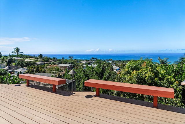 wooden terrace featuring a water view